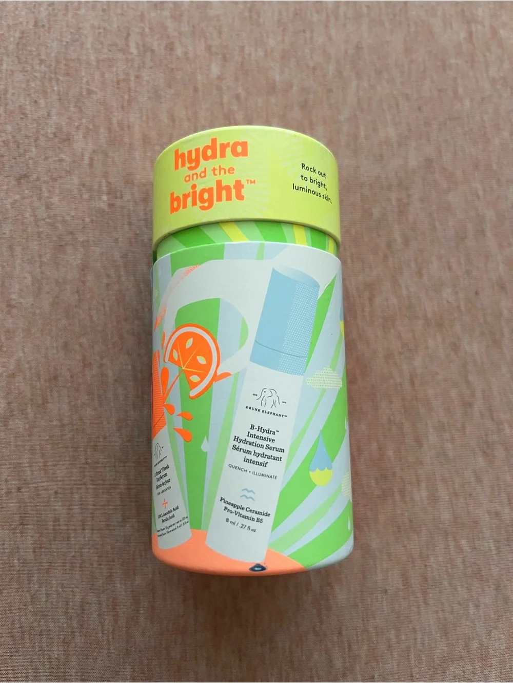Drunk Elephant Hydrating Serum Tube — Lime Green with Orange Accents